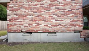 Foundation damage in a Cleveland, TX home showing cracks and settling issues